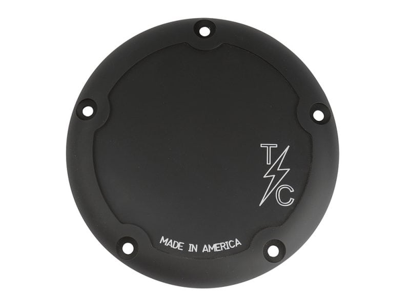 Black motorcycle coil cover with 'TLC' logo and 'Made in America' text for Revelry Motorcycles.