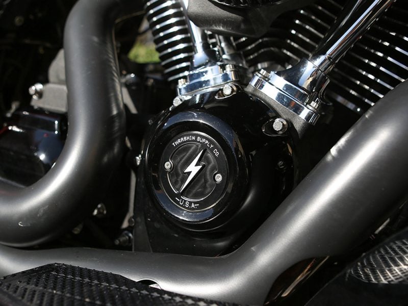 Close-up of a motorcycle engine with black and chrome finishes at Revelry Motorcycles in Australia.