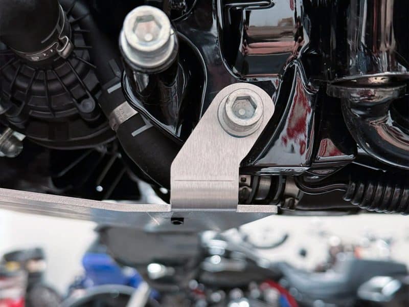 High-performance motorcycle engine close-up, showcasing sleek black and metallic components for Revelry Motorcycles Australia.