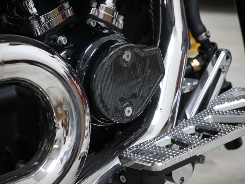 High-performance motorcycle engine detail with chrome and carbon fibre components.