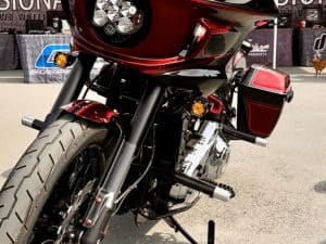 Vivid red and black Revelry motorcycle front view, showcasing modern design and riding essentials.