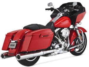 Harley-Davidson touring motorcycle with red saddlebags and front fairing, ideal for long rides and touring.