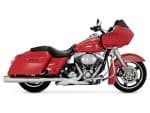 Harley-Davidson touring motorcycle in red with saddlebags and large front fairing.