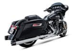 Harley Davidson touring motorcycle with black hard saddlebags and chrome accents, ideal for long-distance rides.