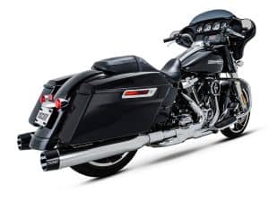 Harley Davidson touring motorcycle with black hard saddlebags and chrome accents, ideal for long-distance rides.
