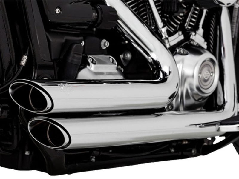 Vivid close-up of a Harley-Davidson motorcycle engine with chrome exhaust pipes, showcasing high-quality custom parts.
