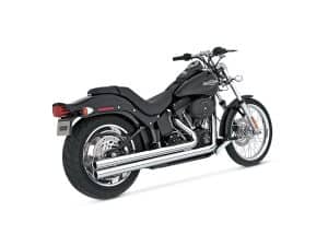 Harley Davidson cruiser motorcycle with black finish and chrome exhaust pipes.