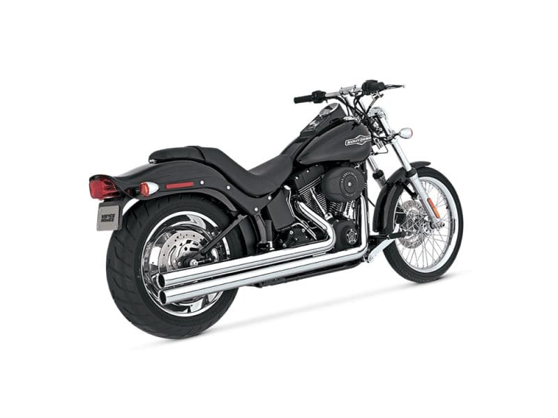 Harley Davidson cruiser motorcycle with black finish and chrome exhaust pipes.