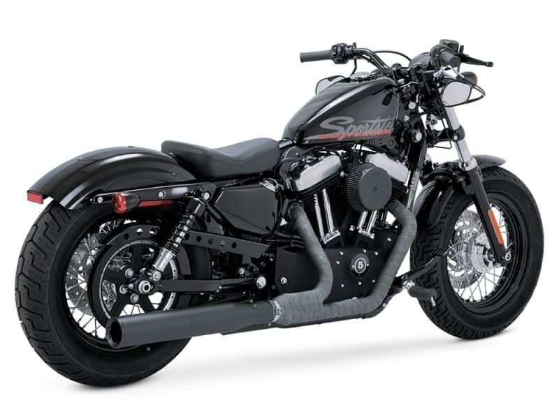 Harley-Davidson motorcycle with black matte finish and custom exhaust for sale.