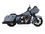 Vivid black touring motorcycle with touring fairing, saddlebags, and V-twin engine.