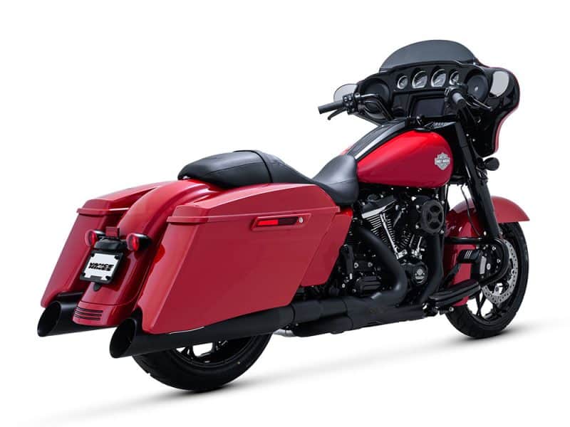 Vivid red Harley-Davidson touring motorcycle with custom hard saddlebags and black accents.