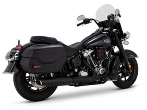 Harley Davidson touring motorcycle with black leather saddlebags and windshield.