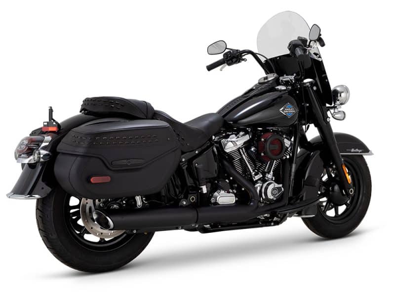 Harley Davidson touring motorcycle with black leather saddlebags and windshield.