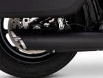 High-performance motorcycle exhaust system with rivet and black finish.
