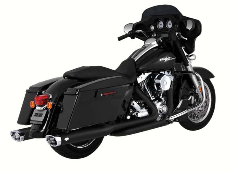 Harley Davidson touring motorcycle with black saddlebags and fairing, perfect for long road trips.