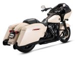 Harley Davidson touring motorcycle with cream and black finish, touring saddle bags, and dual exhausts.