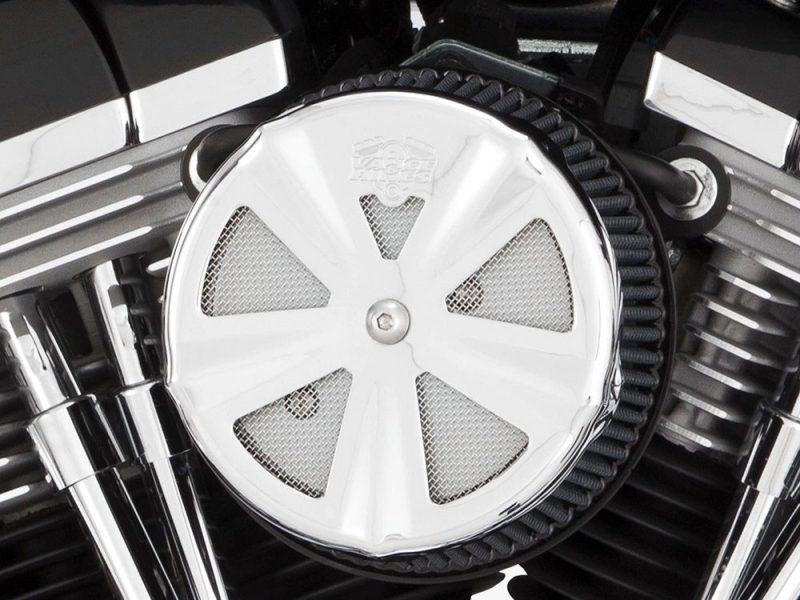 High-performance motorcycle engine close-up, showcasing chrome details and intricate design elements.