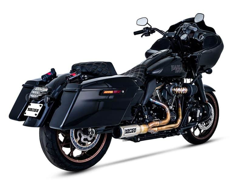Harley Davidson black touring motorcycle with custom exhaust pipes and premium accessories.