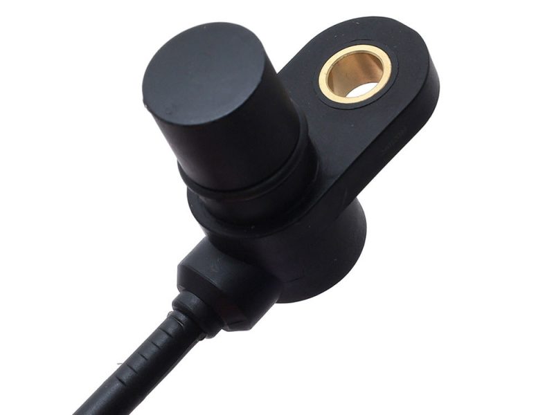 Black motorcycle shock absorber component with gold bushing.