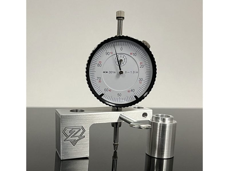 High-precision dial indicator gauge with metal mount for motorcycle precision measurements.